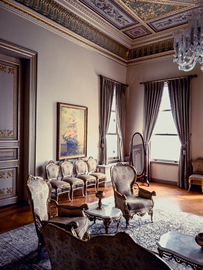 gallery-1 Luxurious antique living room interior featuring elegant furniture and ornate decor in natural light.