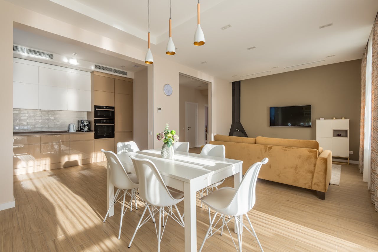 gallery-4 Spacious living room and kitchen with modern design and natural lighting.
